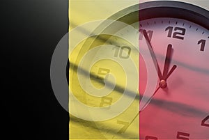 Belgium flag with dial of a clock
