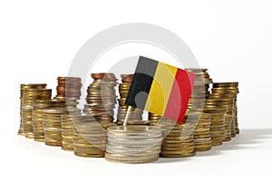 Belgium flag with stack of money coins