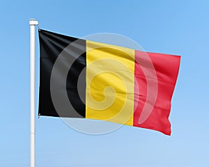 Belgium flag on stick on sky background