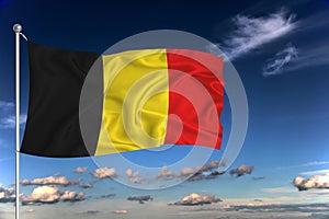 Belgium national flag waving in the wind against deep blue sky.  International relations concept