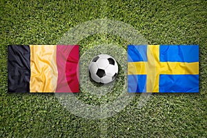 Belgium vs. Sweden flags on soccer field