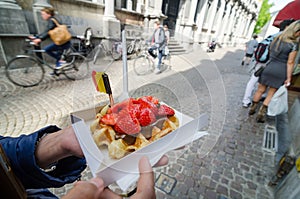 Belgium waffle with chocolate sauce and strawberries