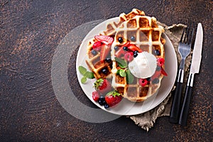 Belgium waffles with berries and ice cream