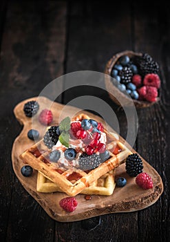 Belgium waffles with fruits and ice cream