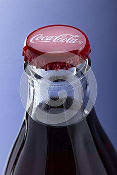 Belgorod , Russia - MAY, 28, 2020: top view of red cap from the glass bottle of Coca-Cola. Classic Bottle Top. Popular Carbonated