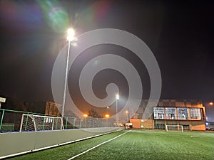 Belgrade, Serbia, October 29, 2020 stadium in lights and flashes. Empty beautiful football field with glowing spotlights