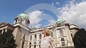 Belgrade, Serbia. Young Woman Standing in Front of National Assembly Government