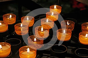 Belief Faith brightened by candle flame