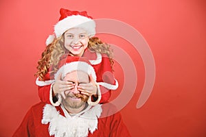 Belief in santa constitutes most magical part of childhood. Guess who. Surprise concept. Girl child and bearded father