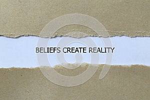 beliefs create reality on white paper