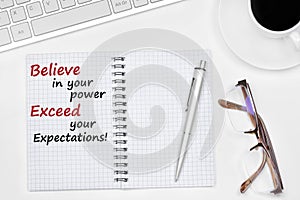 Believe in your power Exceed your expectations text on notebook photo