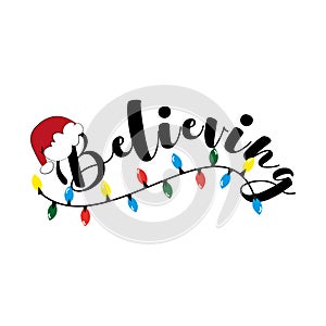 Believing - Christmas calligraphy with Santa`s hat and christmas lights