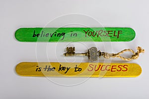Believing in Yourself is the Key to Success. Motivation inspirational script lettering quote about life with key doodle