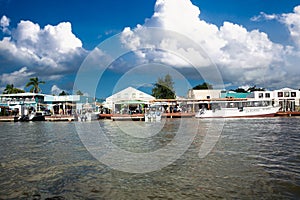 Cruise ship passengers head back to the tenders by the shops at