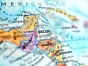 Belize focus macro shot on globe map for travel blogs, social media, website banners and backgrounds.
