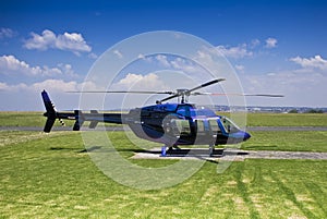 Bell 407 Helicopter - Parked on Helipad photo