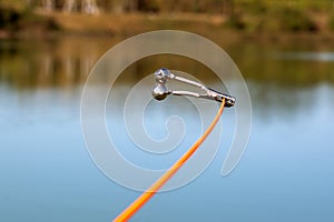 bell alarm is on fishing rod spinning in nature bells of allure are attached to the end of the fishing spinning