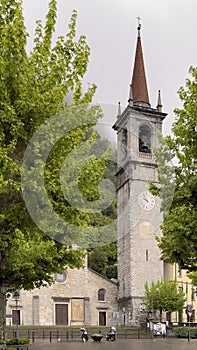 The bell and clock tower of the Church of Saint George in Varenna, Italy.