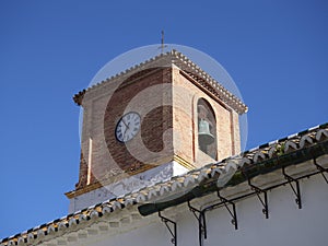 The Bell and clock tower at the Palacio de Los Condes de Puerto Hermoso in downtown Pizarra. photo