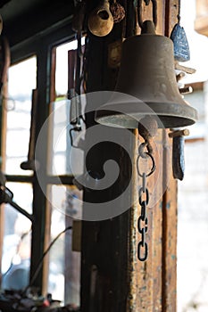 Bell in coppersmith workshop and hand made copper things, Lahich, Azerbaijan. Interior of coppersmith workshop in the