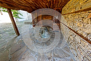 Bell at the entrance to the church of the mountain village of Zheravna in Bulgaria