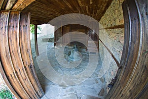 Bell at the entrance to the temple of St. Nicholas in the Bulgarian village of Zheravna