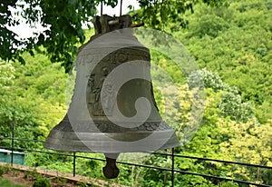 Bell in front of the church of St. John the Baptist