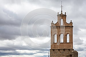 Bell-gable bell tower (wall bell tower) in Puerta del Carmen gate to Wall of Avila, Spain. photo