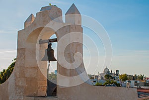 The bell on the guard tower in San Francisco de Campeche, Mexico. View from the fortress walls photo