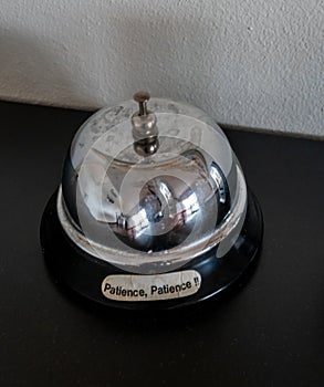 Bell with patience label
