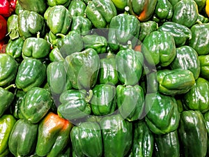 Bell pepper. Heap of fresh green sweet peppers for sale on farming market.