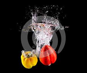 Bell pepper making splash in water.