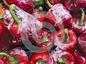 Bell pepper with plastic food wrap in the box