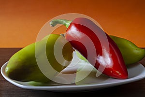 Bell pepper in a plate on an orange background