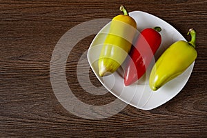 Bell pepper in a plate on a wooden table