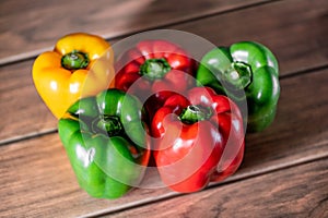 Bell pepper variety of color on a wooden board