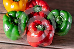 Bell pepper variety of color on a wooden board