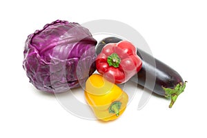 bell peppers, red cabbage and eggplant isolated on white background