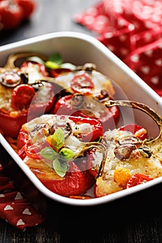 Bell peppers stuffed with rice, vegetables and mozzarella cheese seasoned with herbs