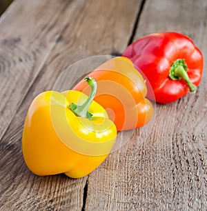 Bell peppers on the wooden background