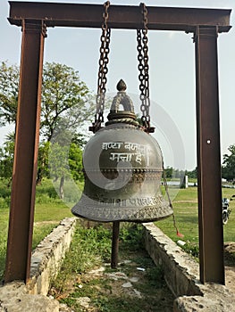 A bell in raj nagar kali mandir campus which is unique and made through copour