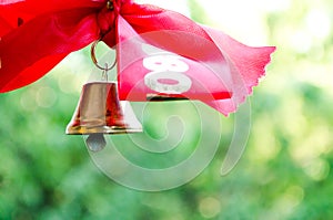 Bell with a ribbon. Last call. A bell with a red ribbon. Spring holiday. School years. Graduation. School bells on the background