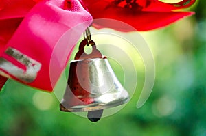 Bell with a ribbon. Last call. A bell with a red ribbon. Spring holiday. School years. Graduation. School bells on the background