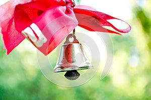 Bell with a ribbon. Last call. A bell with a red ribbon. Spring holiday. School years. Graduation. School bells on the background