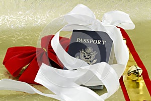 Bell and ribbons with holiday travel passport