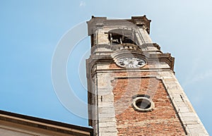 Bell rower of the Santo Stefano Protomartire church in the center of ancient village Appiano Gentile, province of Como, Italy photo