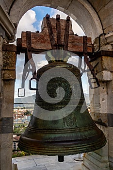 Bell at the top flight of the Leaning Tower of Pisa. Piazza dei Miracoli, Pisa, Tuscany, Italy