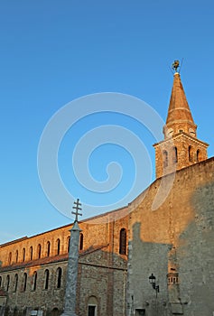 Bell tower of the ancient basilica of St. Euphemia in the town o