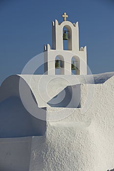 Bell tower of the beautiful small church on the hill near Akrotiri, Santorini, Greece.