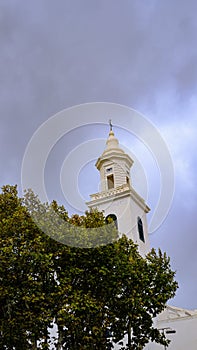 Bell tower behind tree, Menorca, Balearic Islands, Spain